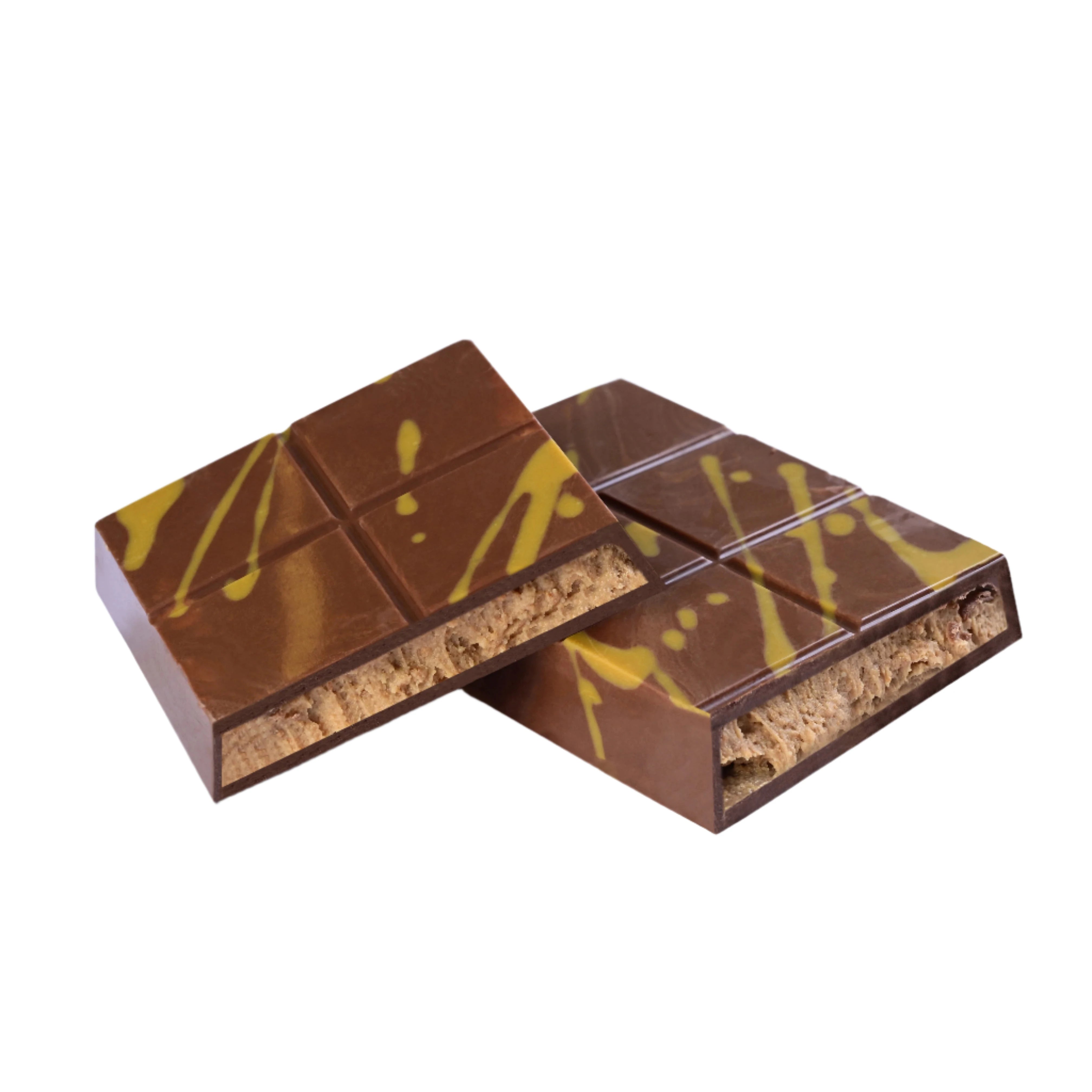 Chocolate bar featuring a spiced speculoos biscuit cream filling with biscuit crumbs, surrounded by broken pieces and whole biscuits.