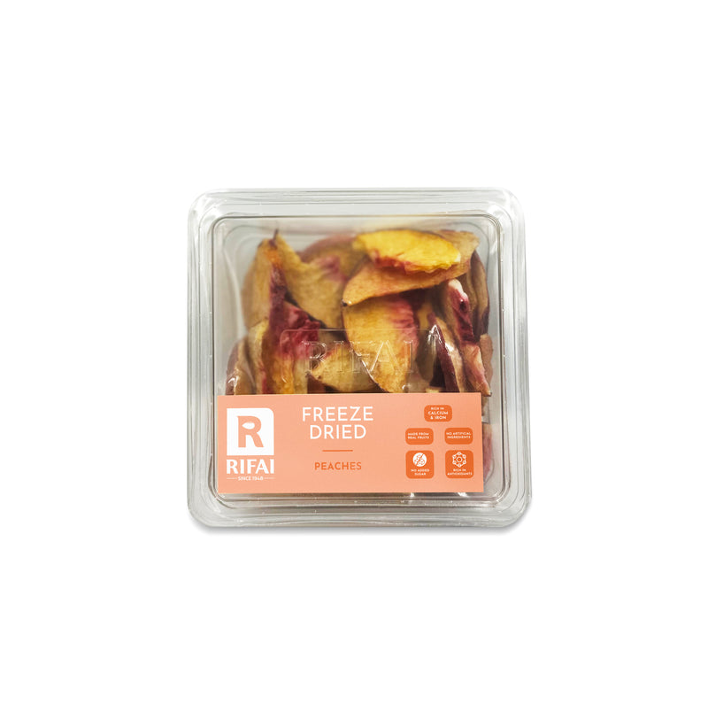 Crispy freeze-dried peach slices with a soft orange hue, offering a sweet and juicy flavor.